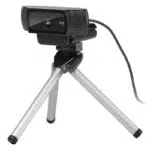 Logitech C920 PRO HD Webcam on a tripod with a black body and silver legs.